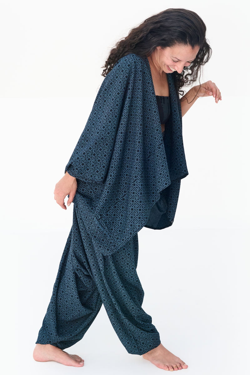 Avanyah’s Arabesque Aladdin pants with matching beach cover-up, a versatile festival outfit combining art wear and alternative fashion for all genders.